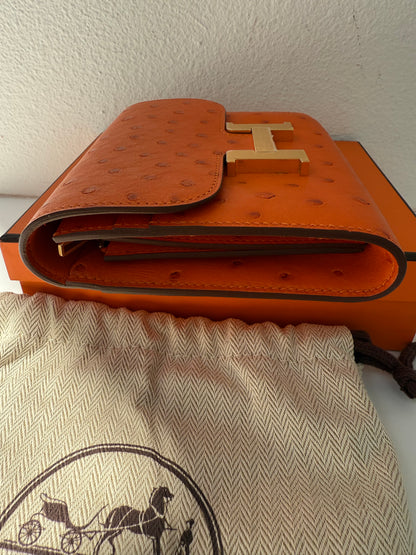 NEW RARE HERMES Constance Short Wallet Clutch in Orange Ostrich with Palladium HW& Leather Strap