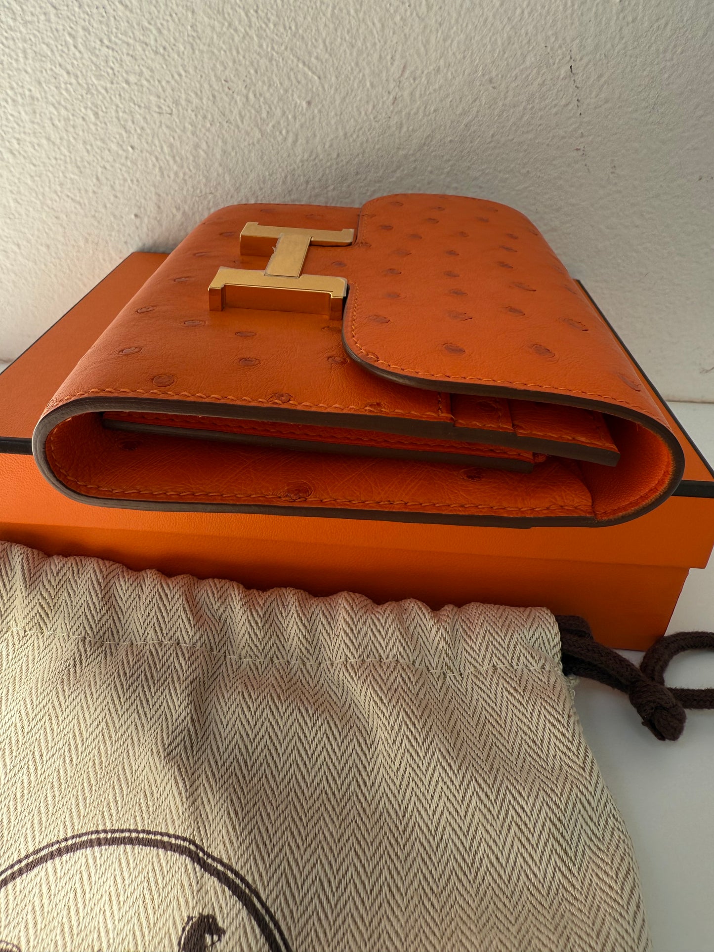 NEW RARE HERMES Constance Short Wallet Clutch in Orange Ostrich with Palladium HW& Leather Strap