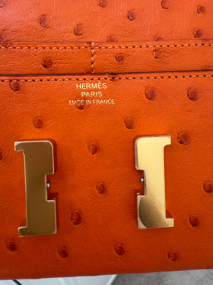 NEW RARE HERMES Constance Short Wallet Clutch in Orange Ostrich with Palladium HW& Leather Strap