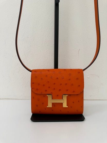 NEW RARE HERMES Constance Short Wallet Clutch in Orange Ostrich with Palladium HW& Leather Strap